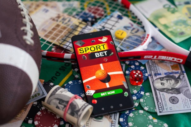 Boom City player interface on mobile showing live dealer stream, betting controls, and football scoreboard panel
